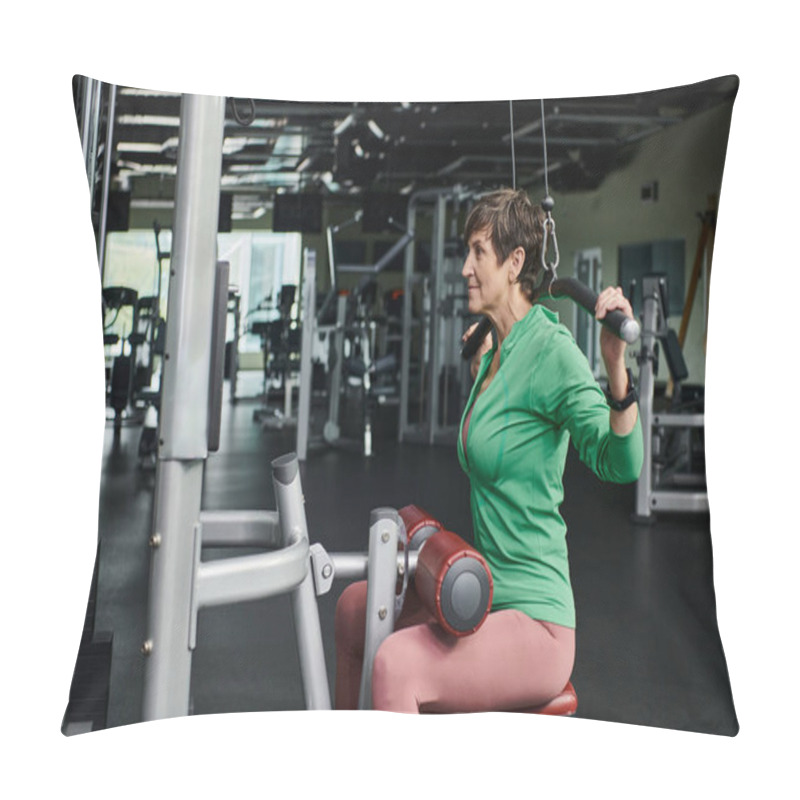 Personality  Athletic And Motivated Elderly Woman Working Out In Gym, Mature Fitness, Exercise Machine, Side View Pillow Covers