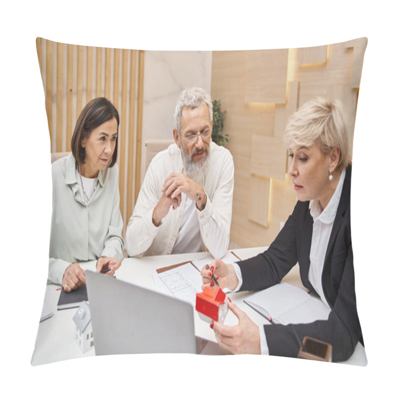 Personality  Middle Aged Realtor Showing Carton House Model To Married Couple In Real Estate Office, Property Pillow Covers