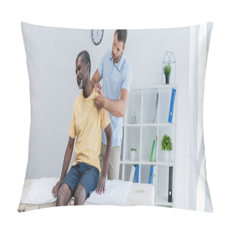 Personality  Middle Aged African American Man Sitting On Massage Table While Rehabilitologist Examining His Shoulder, Banner Pillow Covers