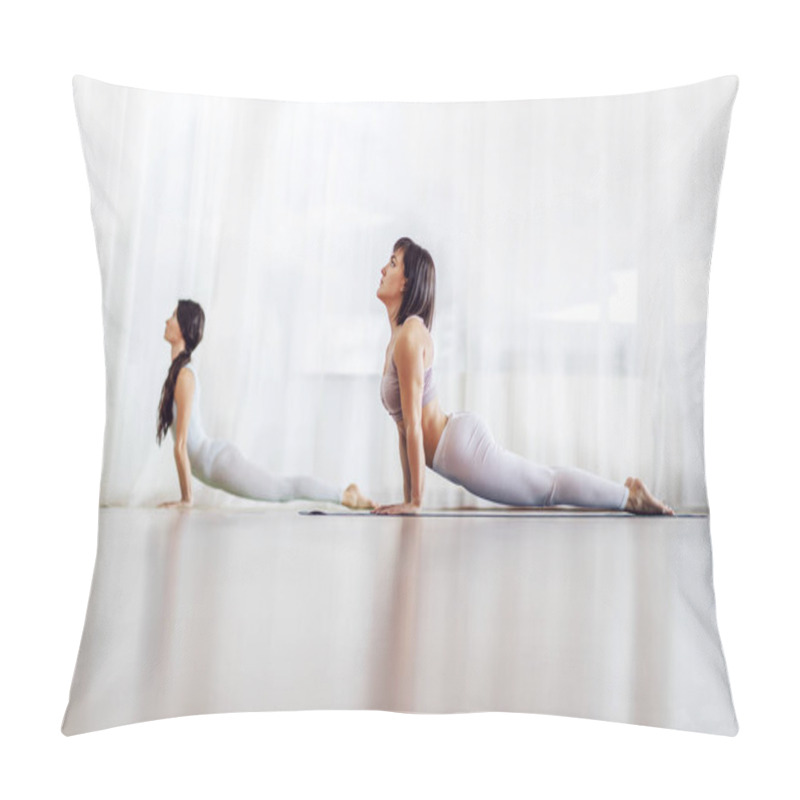 Personality  Two Focused Fit Attractive Caucasian Girls Doing Yoga In Yoga Studio. They Are In Upward-Facing Dog Position. Selective Focus On The Girl In Foreground. Pillow Covers