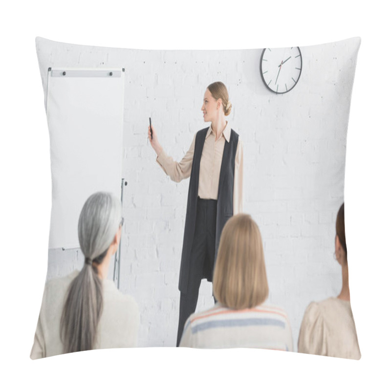 Personality  Cheerful Speaker Looking At Blank Flipchart Near Woman During Seminar On Blurred Foreground  Pillow Covers