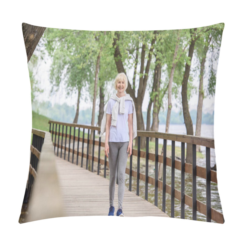 Personality  Senior Woman In Sportswear Walking On Wooden Path In Park Pillow Covers