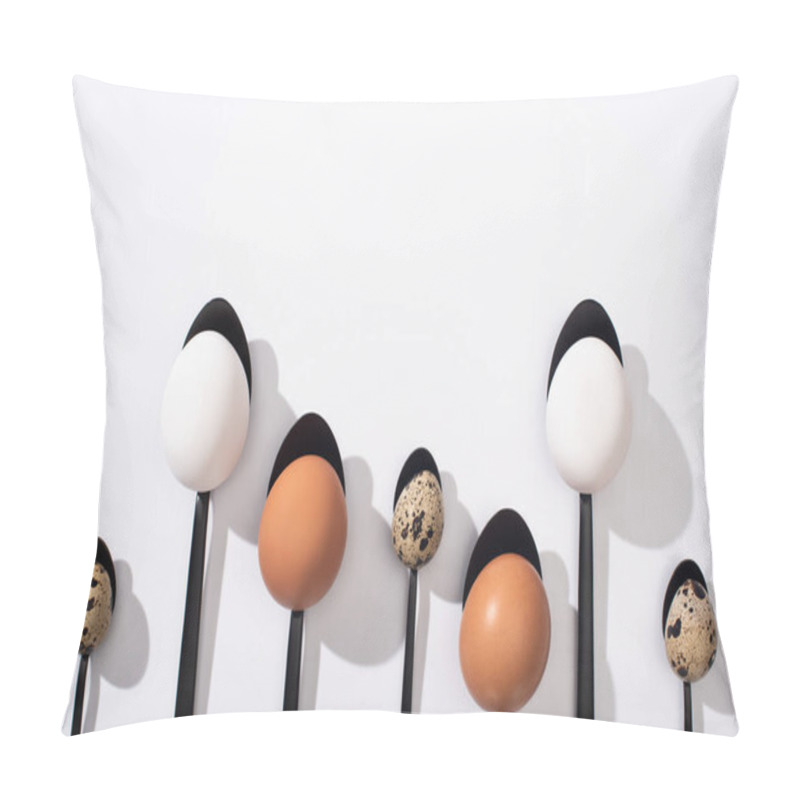 Personality  Top View Of Quail Eggs, White And Brown Chicken Eggs On Black Spoons On White Background Pillow Covers