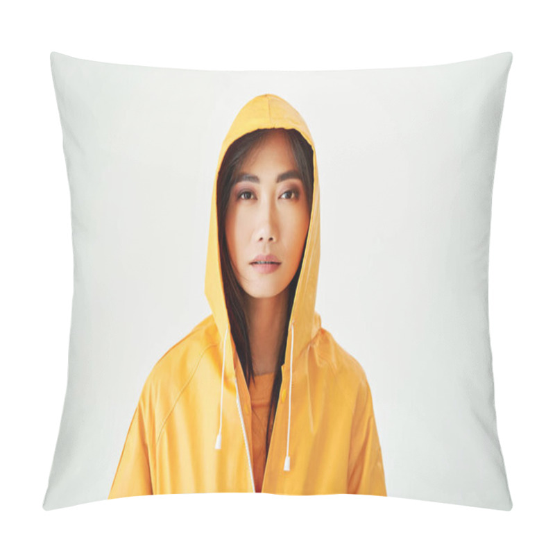 Personality  Close Up Portrait Of Serious Asian Girl Dressed In Bright Yellow Raincoat Posing With Hood On Her Head On White Studio Background Pillow Covers