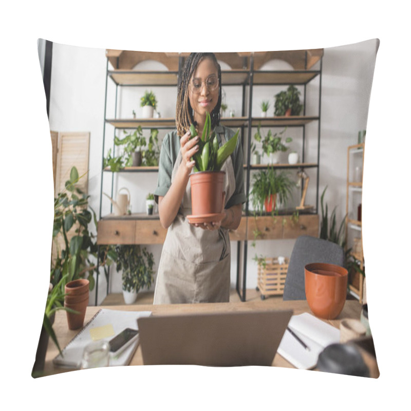 Personality  Smiling African American Florist In Apron Touching Leaves Of Green Potted Plant While Standing Near Desk In Flower Shop Pillow Covers