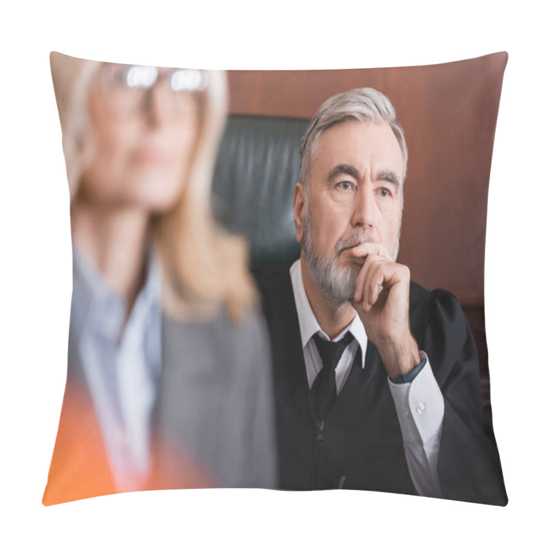 Personality  Senior Judge Holding Hand Near Face While Thinking Near Advocate On Blurred Foreground Pillow Covers