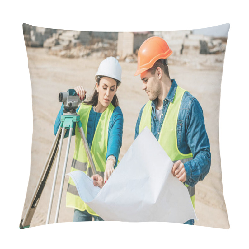 Personality  Surveyor With Digital Level Pointing On Blueprint To Colleague  Pillow Covers