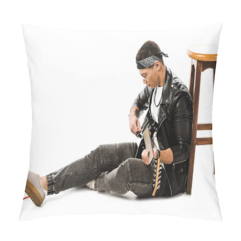 Personality  Concentrated Young Man Musician In Leather Jacket Playing On Electric Guitar While Sitting On Floor Near Chair Isolated On White Pillow Covers