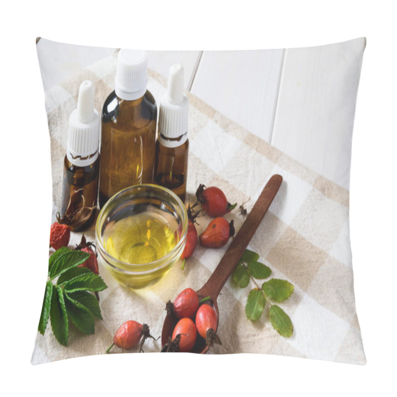 Personality  Natural Cosmetics, Natural Eco Product, Composition Glass Bottles With Rosehip Oil, Rosehips On A Light Wooden Table Pillow Covers