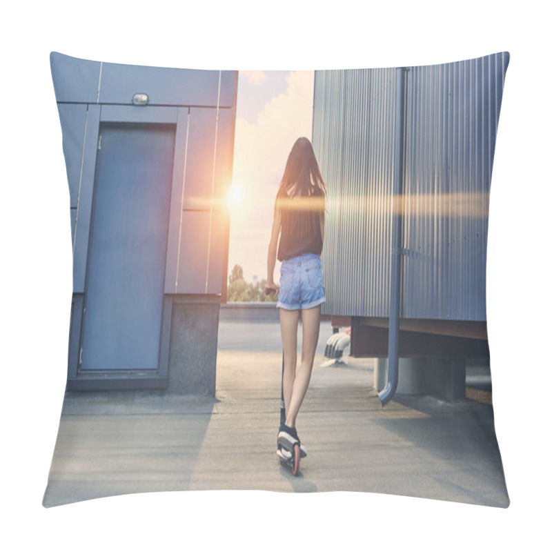 Personality  Back View Of Young Woman Riding Scooter On Roof With Sunbeams Pillow Covers