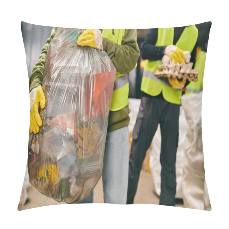 Personality  Two Young Volunteers In Safety Vests, Gloves, And Holding A Huge Bag Of Garbage While Sorting Trash. Pillow Covers