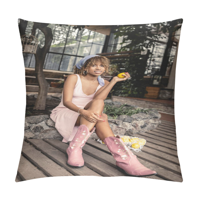 Personality  Full Length Of Smiling Young African American Woman In Boots And Summer Outfit Holding Fresh Lemon While Sitting Near Mesh Bag In Blurred Orangery, Chic Woman In Tropical Garden, Summer Concept Pillow Covers