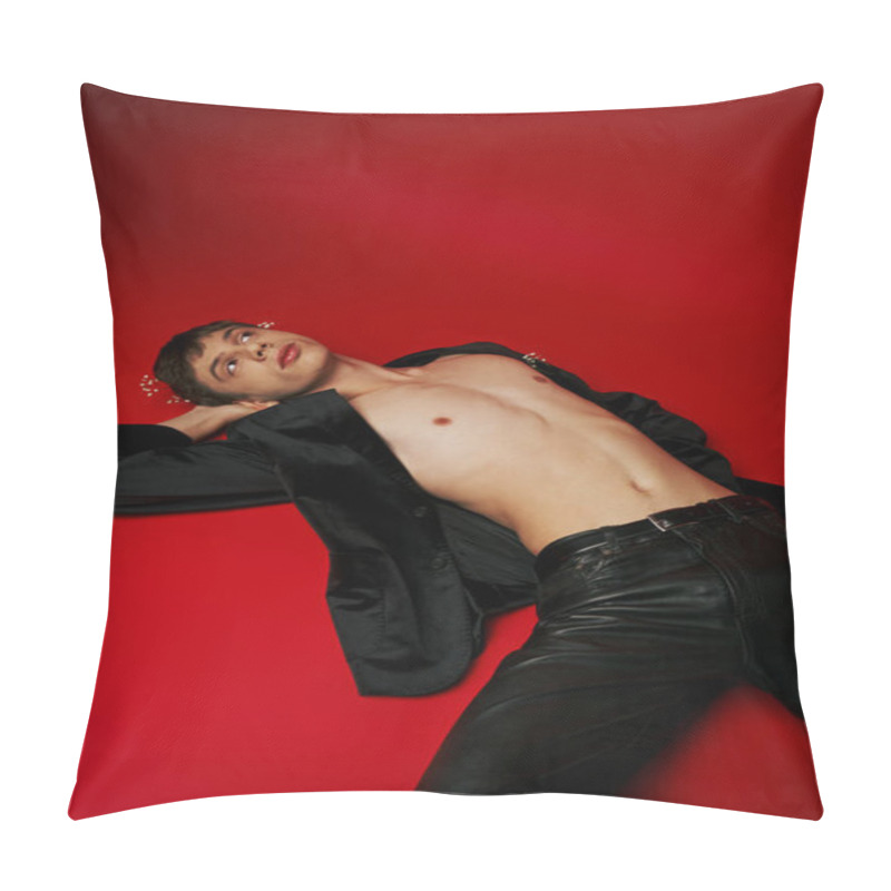 Personality  Dreamy Young Male Model In Jacket And Flowers In Hair Lying And Looking Up On Red Background Pillow Covers