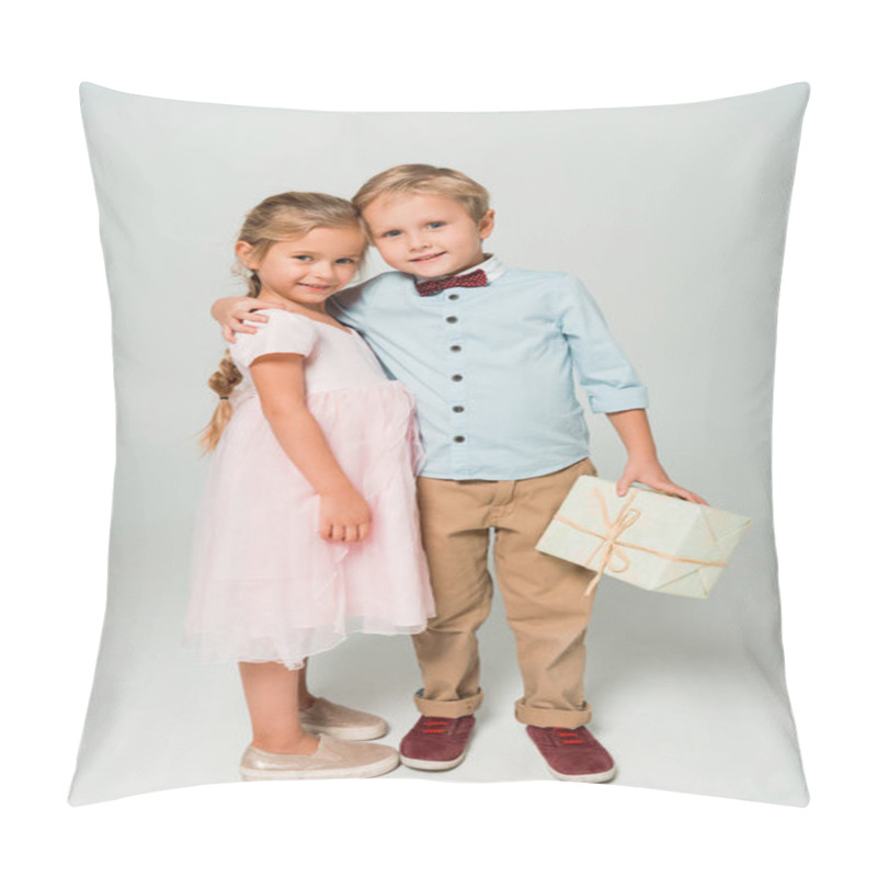 Personality  Cute Boy Holding Gift Box And Embracing Adorable Sister On Grey Background Pillow Covers