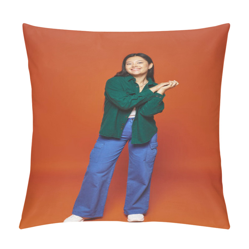 Personality  Radiant Young Asian Girl Posing In Vibrant Outfit And Looking At Camera On Orange Background Pillow Covers