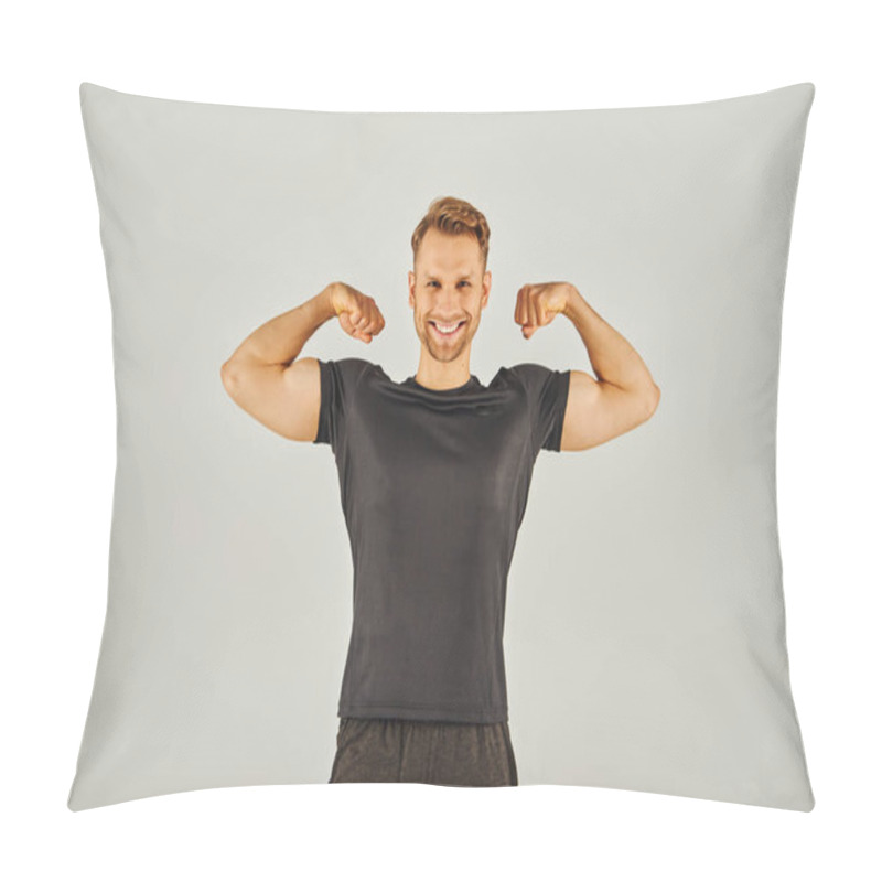 Personality  A Young Athletic Man In Active Wear Flexing His Muscles In Front Of A Gray Background In A Studio. Pillow Covers