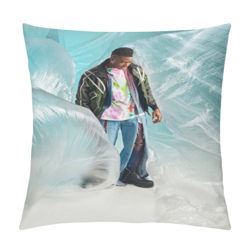 Personality  Full Length Of Fashionable Afroamerican Male Model In Outwear Jacket With Led Stripes And Ripped Jeans Standing Near Cellophane On Turquoise Background, Creative Expression, DIY Clothing  Pillow Covers