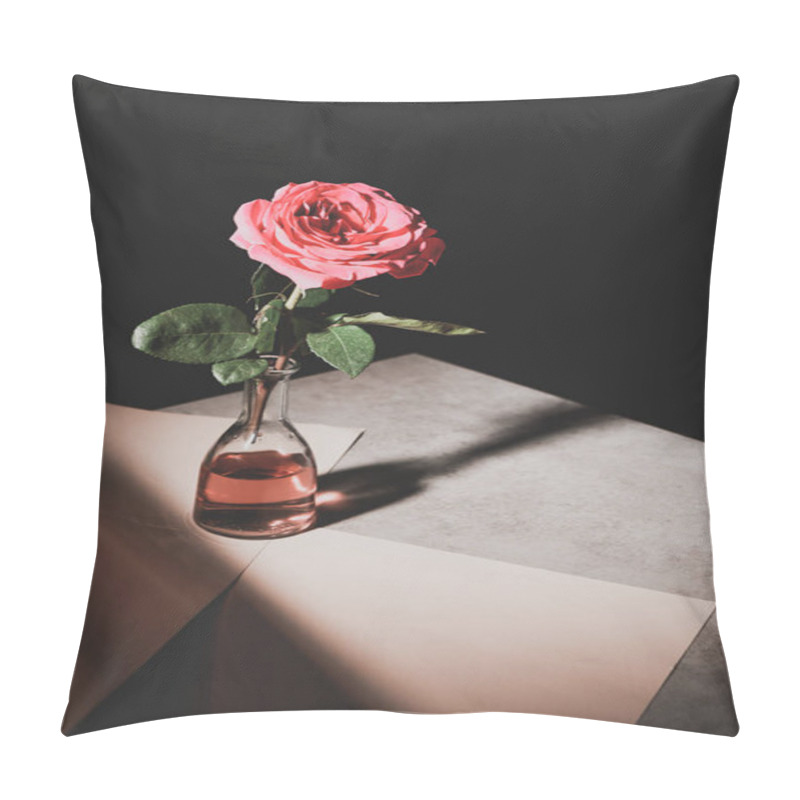 Personality  Pink Rose Flower In Glass Bottle On Stone Table With Sheets Of Paper Isolated On Black Pillow Covers