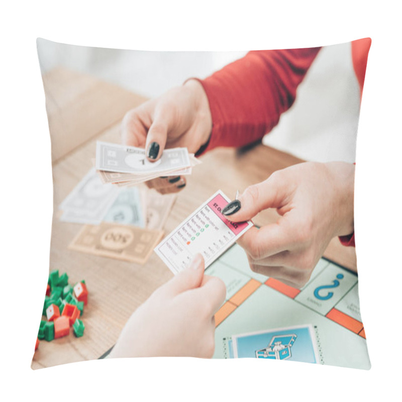 Personality  KYIV, UKRAINE - NOVEMBER 15, 2019: Cropped View Of Women Playing Monopoly Game At Table Pillow Covers