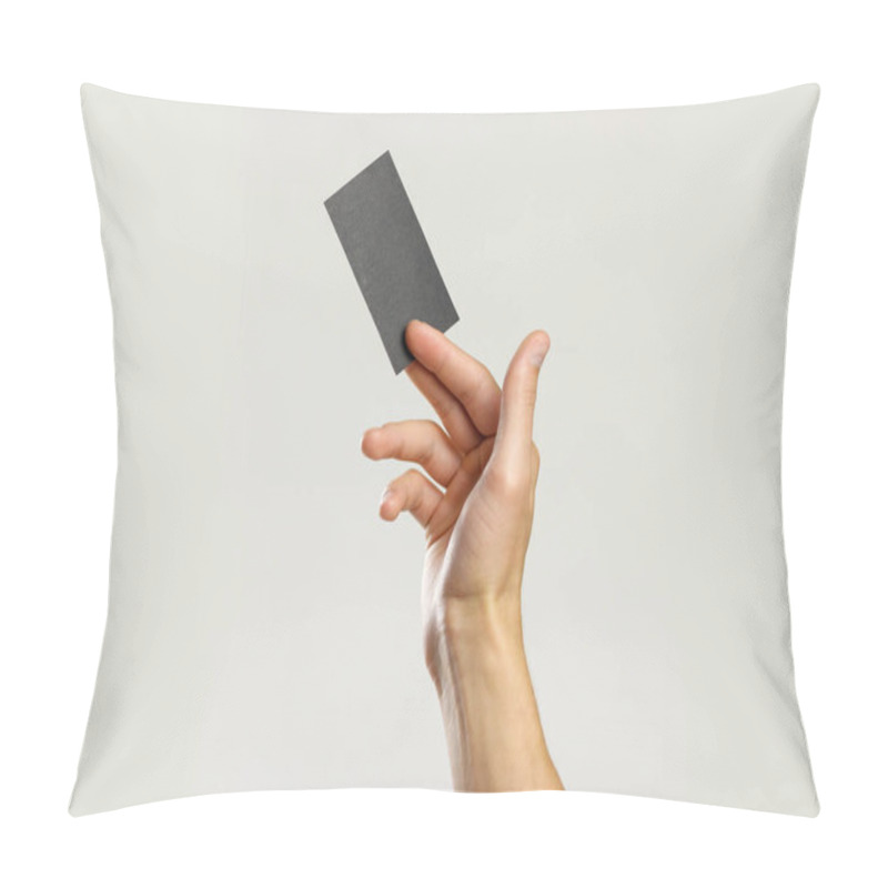 Personality  Male Hands Holding A Black Sheet Of Paper. Isolated On Gray Back Pillow Covers