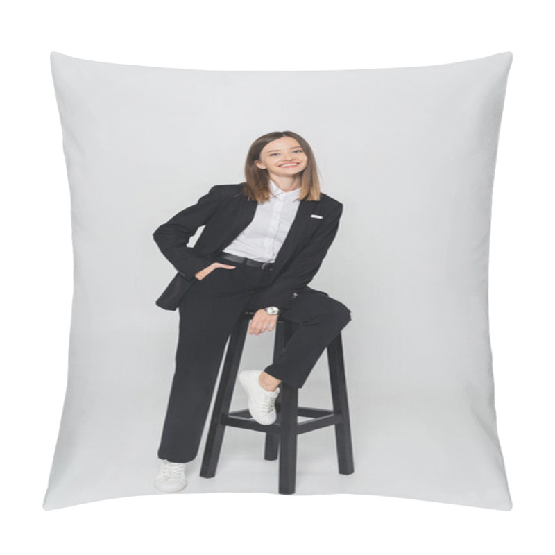 Personality  Full Length Of Happy Woman In Suit Posing With Hand In Pocket While Sitting Chair On Grey Pillow Covers