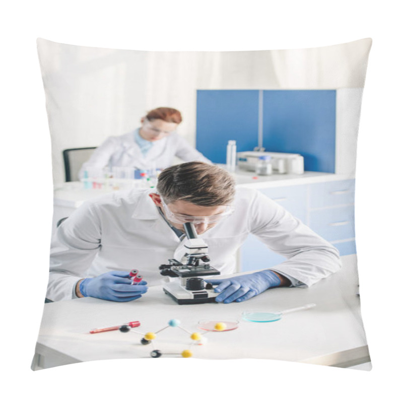 Personality  Selective Focus Of Genetic Consultant Holding Test Tubes And Using Microscope In Lab  Pillow Covers