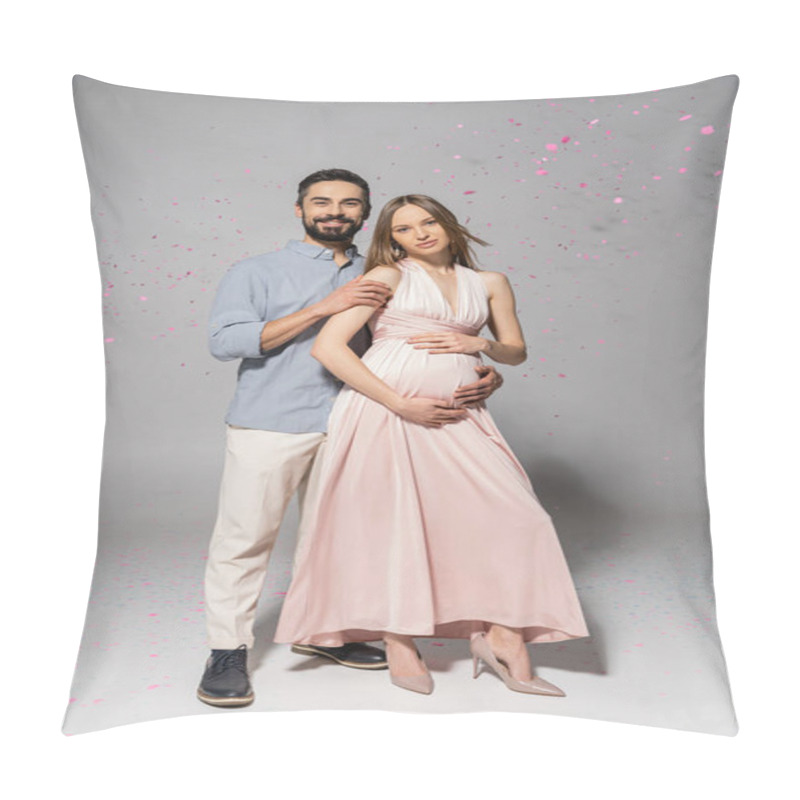 Personality  Full Length Of Positive And Elegant Man Hugging Pregnant Wife In Dress While Standing Under Confetti During Baby Shower Party On Grey Background, Expecting Parents Concept  Pillow Covers