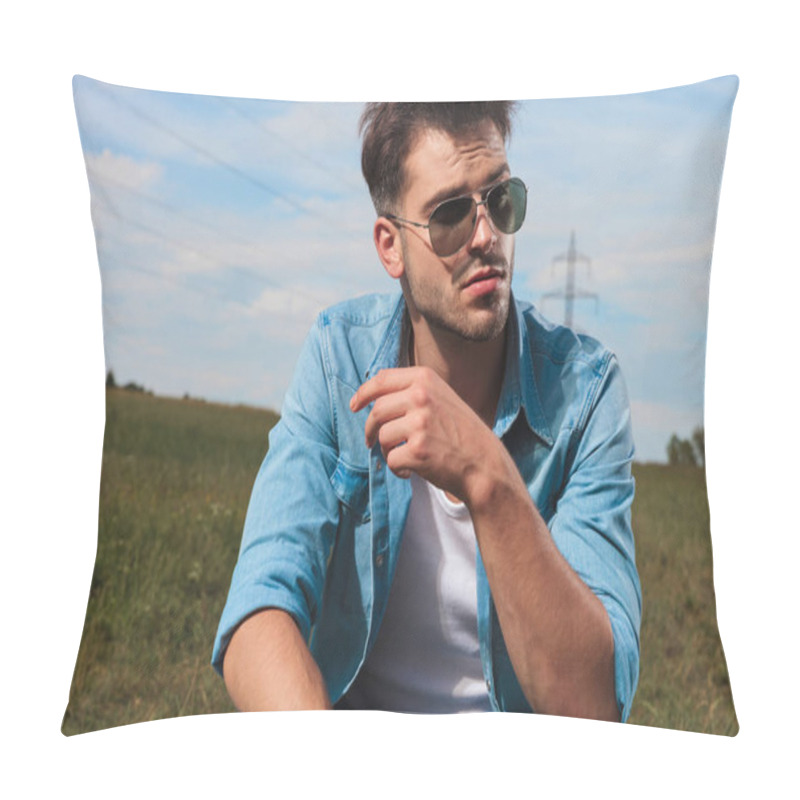 Personality  Portrait Of Handsome Casual Man Wearing Sunglasses And Denim Shirt Crouching In A Field Outside And Looking To Side Pillow Covers