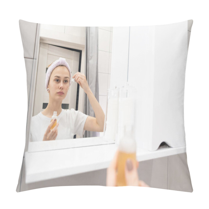 Personality  Skin Care Concept. Young Girl Applies Serum To Her Face In Front Of The Bathroom Mirror. Pillow Covers