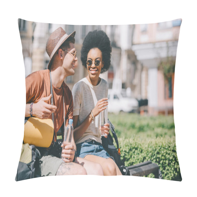 Personality  Happy Interracial Couple Of Tourists With Bottles Of Water Sitting On Bench  Pillow Covers