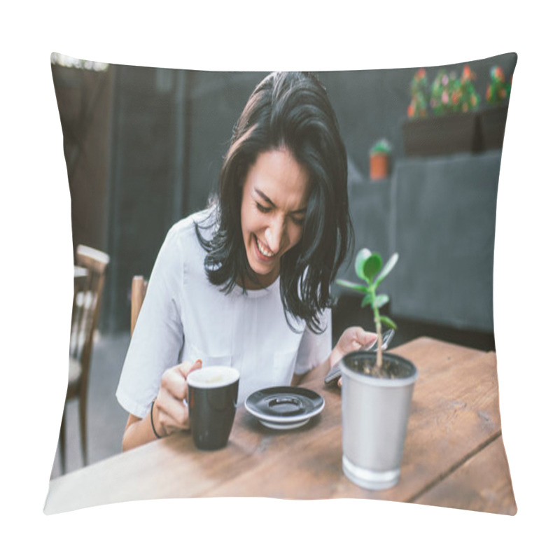 Personality  Happy Young Brunette Female Student With Laughing And Siting In Modern Cafe Interior, Using Cell Phone, Checking Newsfeed On Her Social Network Accounts. Pretty Girl Surfing Internet On Mobile Pillow Covers