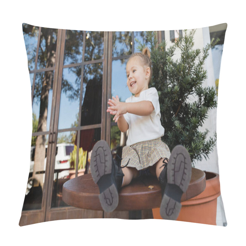 Personality  Positive Toddler Girl In Skirt And White T-shirt Clapping Hands While Sitting On Bistro Table In Miami  Pillow Covers