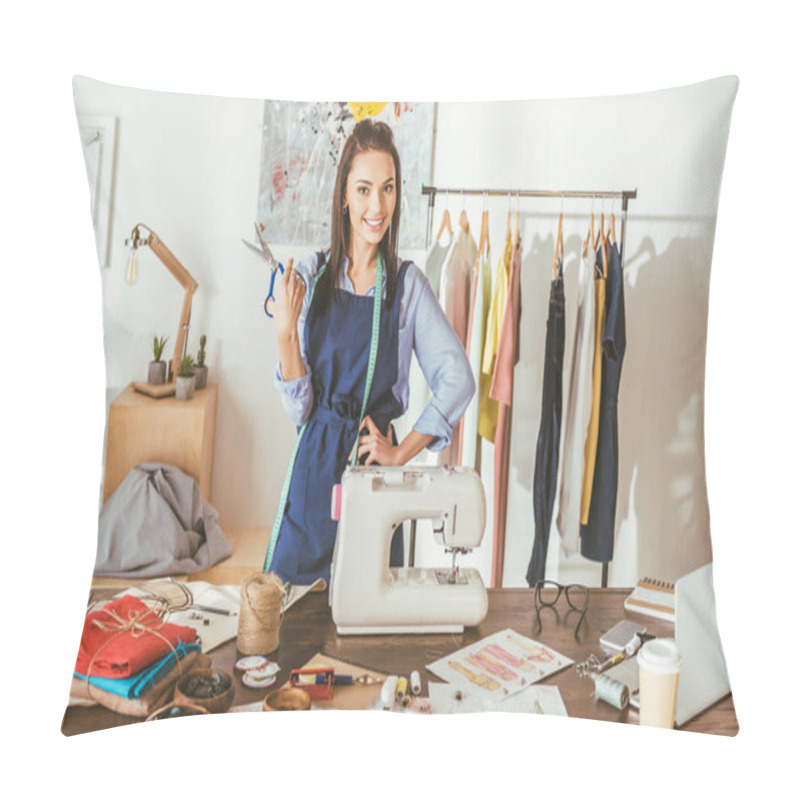 Personality  Smiling Seamstress Posing With Scissors At Working Place And Looking At Camera Pillow Covers