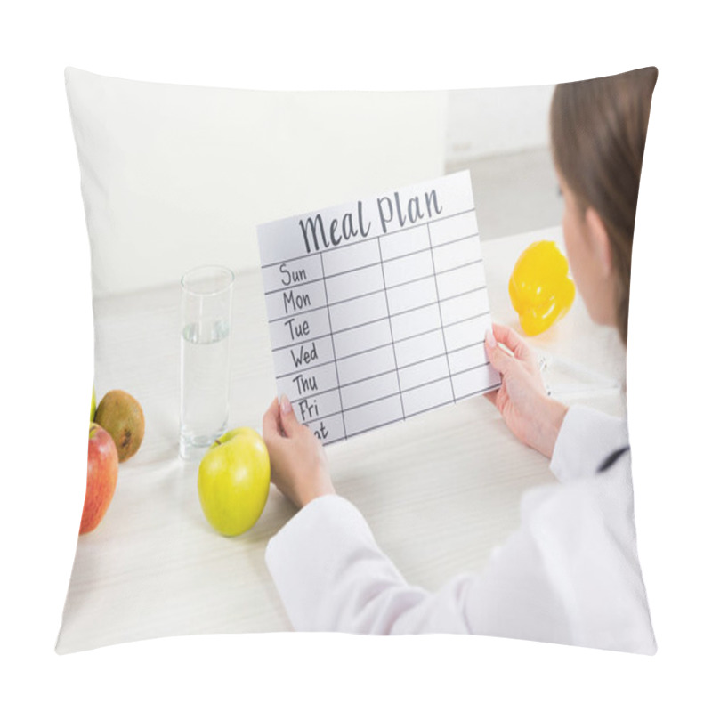 Personality  Cropped View Of Dietitian In White Coat Holding Meal Plan At Workplace Pillow Covers