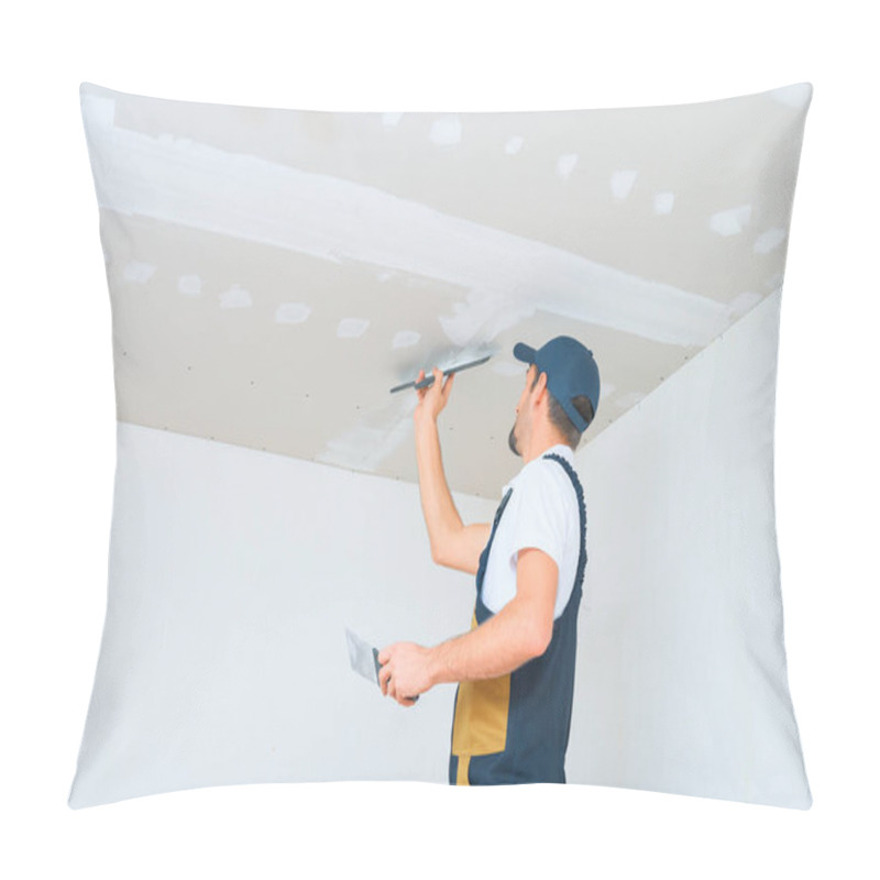 Personality  A Uniformed Worker Applies Putty To The Drywall Ceiling. Putty Of Joints Of Drywall Sheets. Pillow Covers