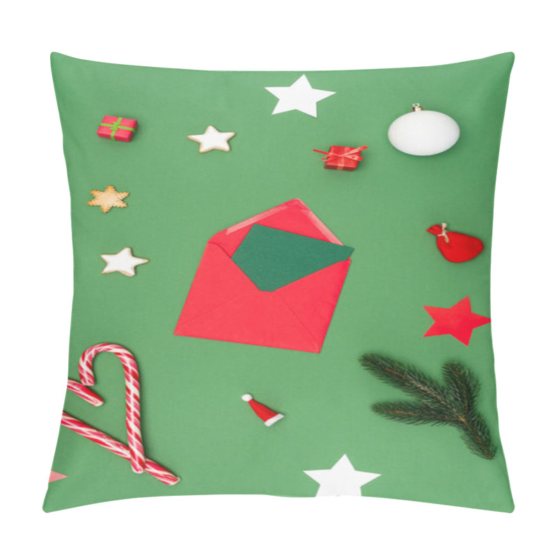 Personality  Top View Of Red Envelope With Card Near Christmas Baubles, Baked Stars And Candy Canes On Green Pillow Covers