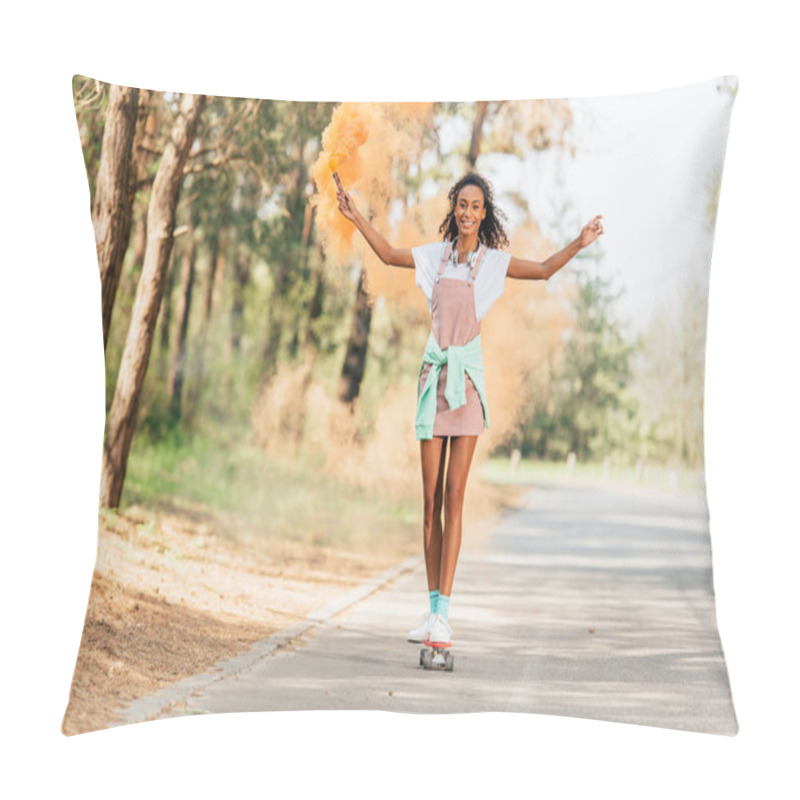 Personality  Full Length View Of Smiling African American Girl Skateboarding And Holding Orange Smoke Grenade On Road Pillow Covers