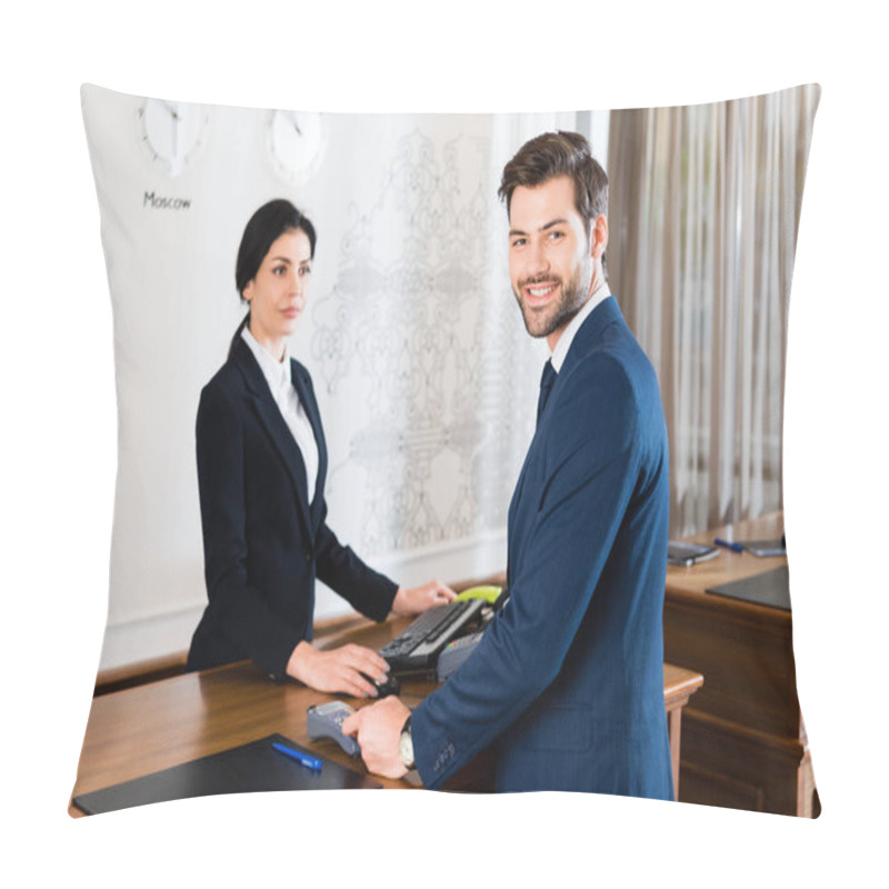 Personality  Selective Focus Of Happy Businessman Holding Credit Card Near Serious Receptionist  Pillow Covers