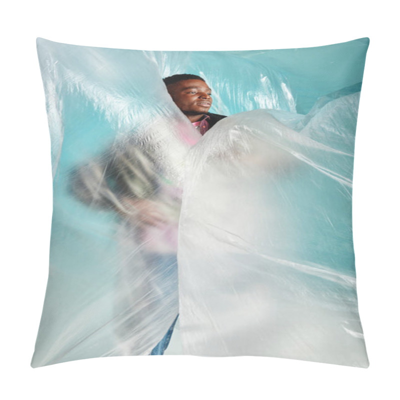 Personality  Young African American Man With Trendy Hairstyle Looking Away While Standing In Cellophane On Turquoise Background, Urban Outfit And Modern Pose, Creative Expression, DIY Clothing  Pillow Covers