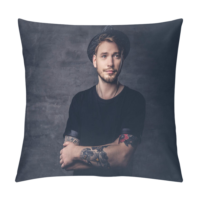 Personality  Portrait Of Handsome Bearded Hipster With Crossed Tattooed Arms, Dressed In A Black T-shirt And Hat. Isolated On A Dark Background. Pillow Covers