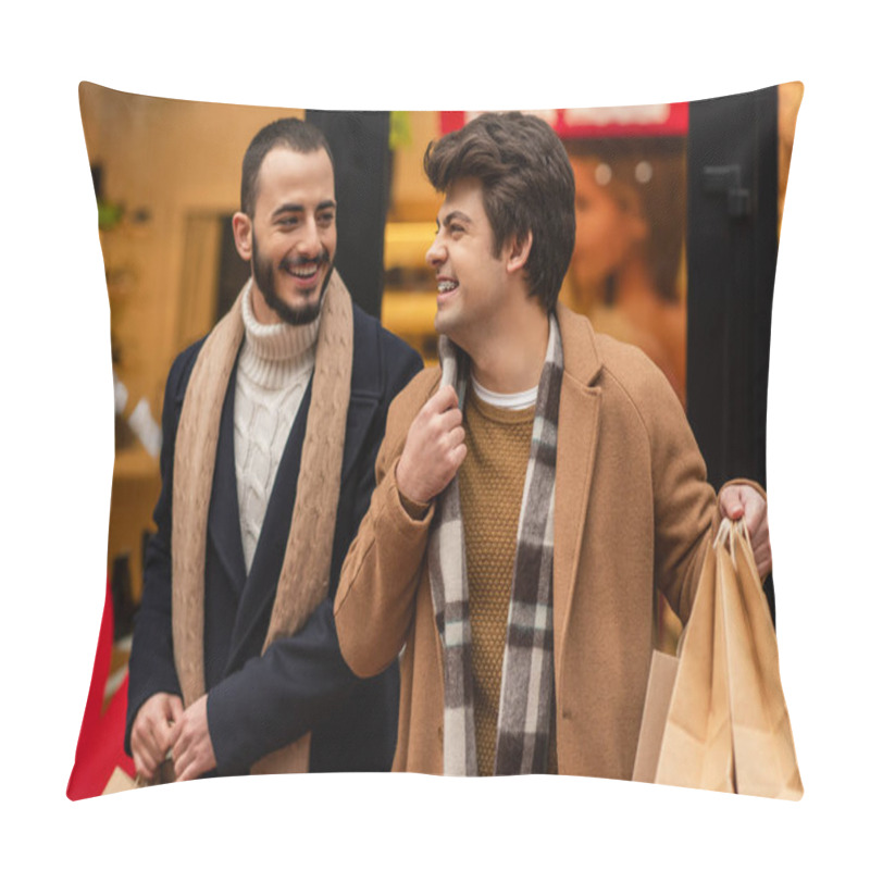 Personality  Smiling Gay Man Holding Shopping Bags And Adjusting Scarf Near Trendy Bearded Boyfriend And Blurred Showcase Pillow Covers