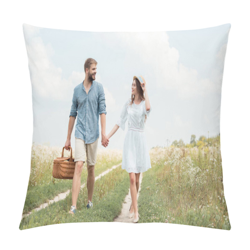 Personality  Smiling Couple With Picnic Basket Holding Hands While Walking In Field Pillow Covers