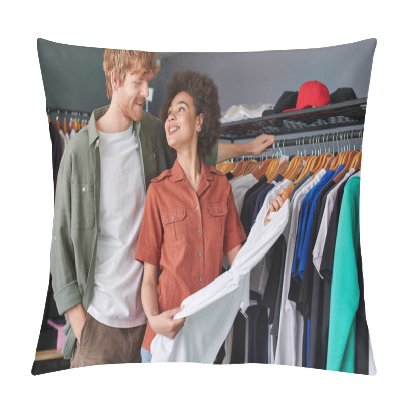 Personality  Cheerful Young African American Craftswoman Holding Clothes On Hanger Near Redhead Colleague And Standing In Print Studio At Background, Young Small Business Owners Concept  Pillow Covers