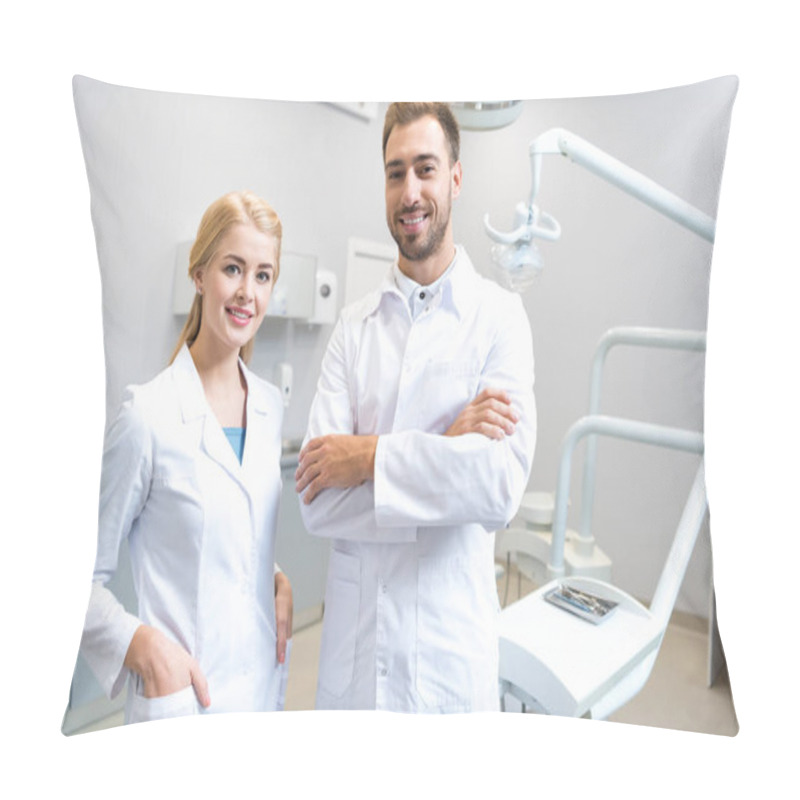 Personality  Young Male And Female Dentists Looking At Camera In Dental Office Pillow Covers