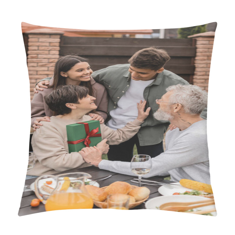 Personality  Positive Middle Aged Mother Holding Gift Box Near Children And Husband During Parents Day Celebration Near Summer Food And Bbq Party At Backyard In June, Celebrating Parenthood Day Concept Pillow Covers