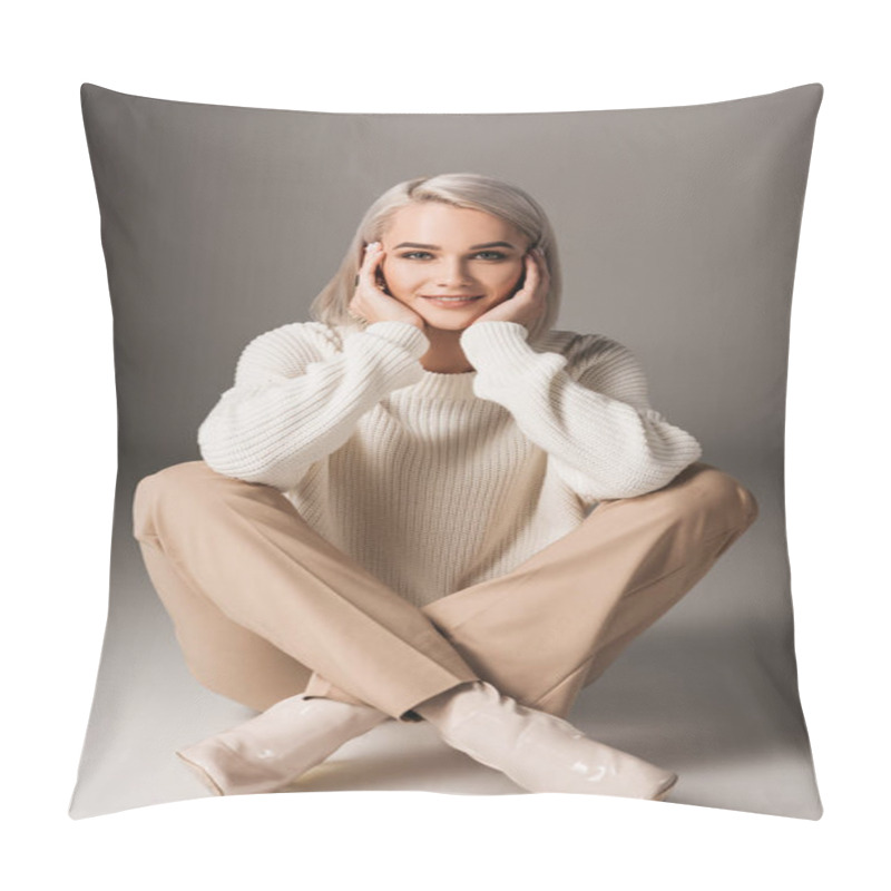 Personality  Beautiful Girl Sitting In White Sweater And Beige Pants, On Grey Pillow Covers