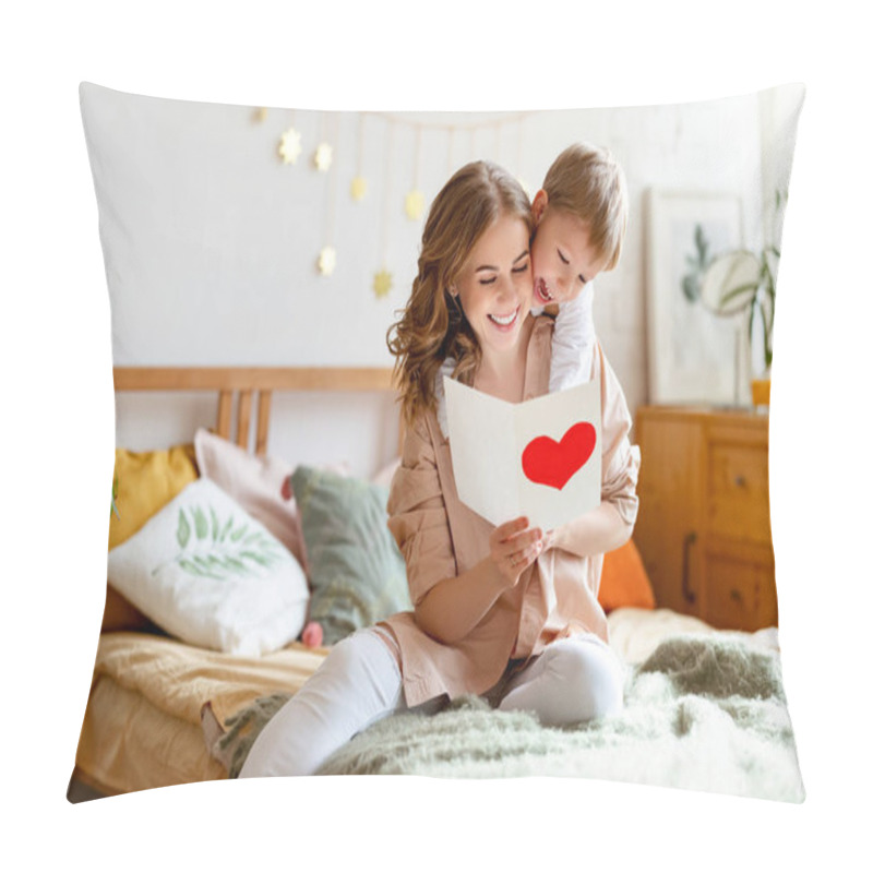 Personality  Cheerful Mother Hugging Son And Reading Handmade Greeting Card With Heart While Resting On Bed During Holiday Celebration Mothers Day  At Home Pillow Covers