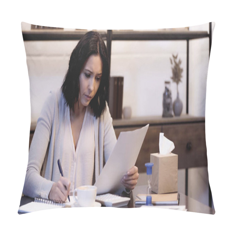 Personality  Worried Woman Sitting On Table With Cup Op Coffee, Holding Documents And Writing In Notebook At Home Pillow Covers