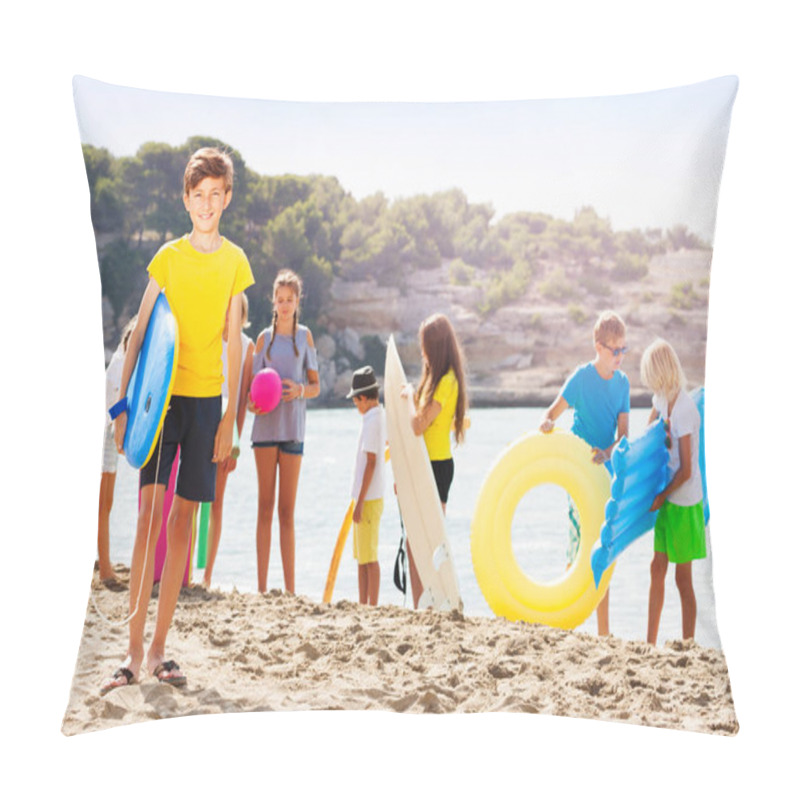 Personality  Boy Stand On The Sand Beach With Group Of Friends On Background Holding Swimming Boards And Inflatable Toys Pillow Covers