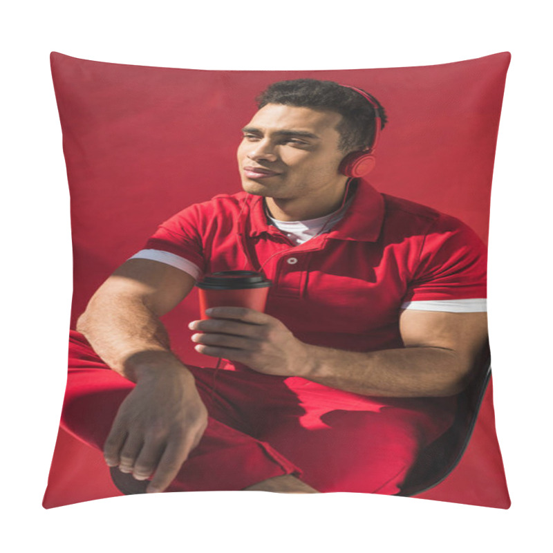 Personality  Stylish Mixed Race Man In Headphones Sitting, Holding Coffee To Go And Posing On Red Pillow Covers